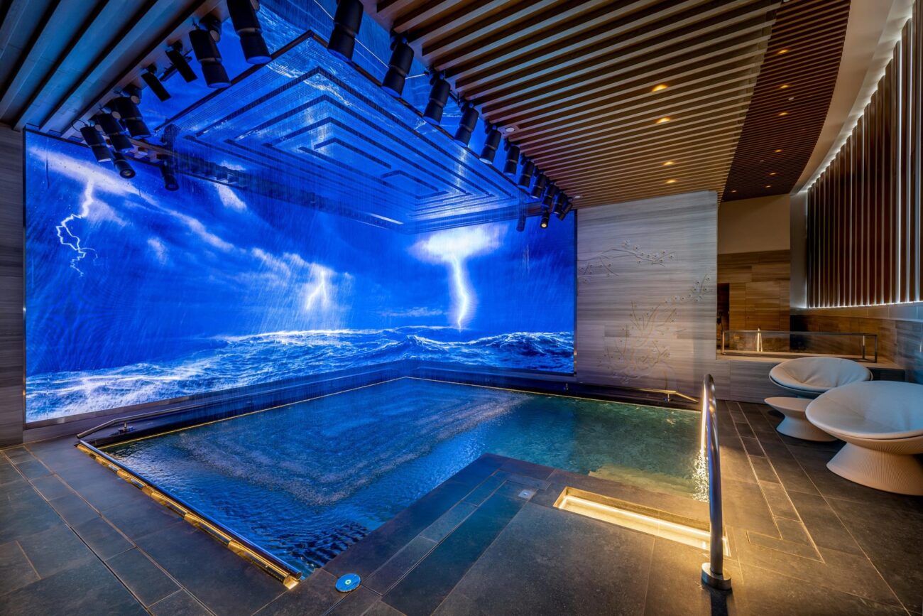 Supercell storm content by S1T2 shows on an immersive LED display as part of the Experience Pool at MGM Macau Tria Spa.